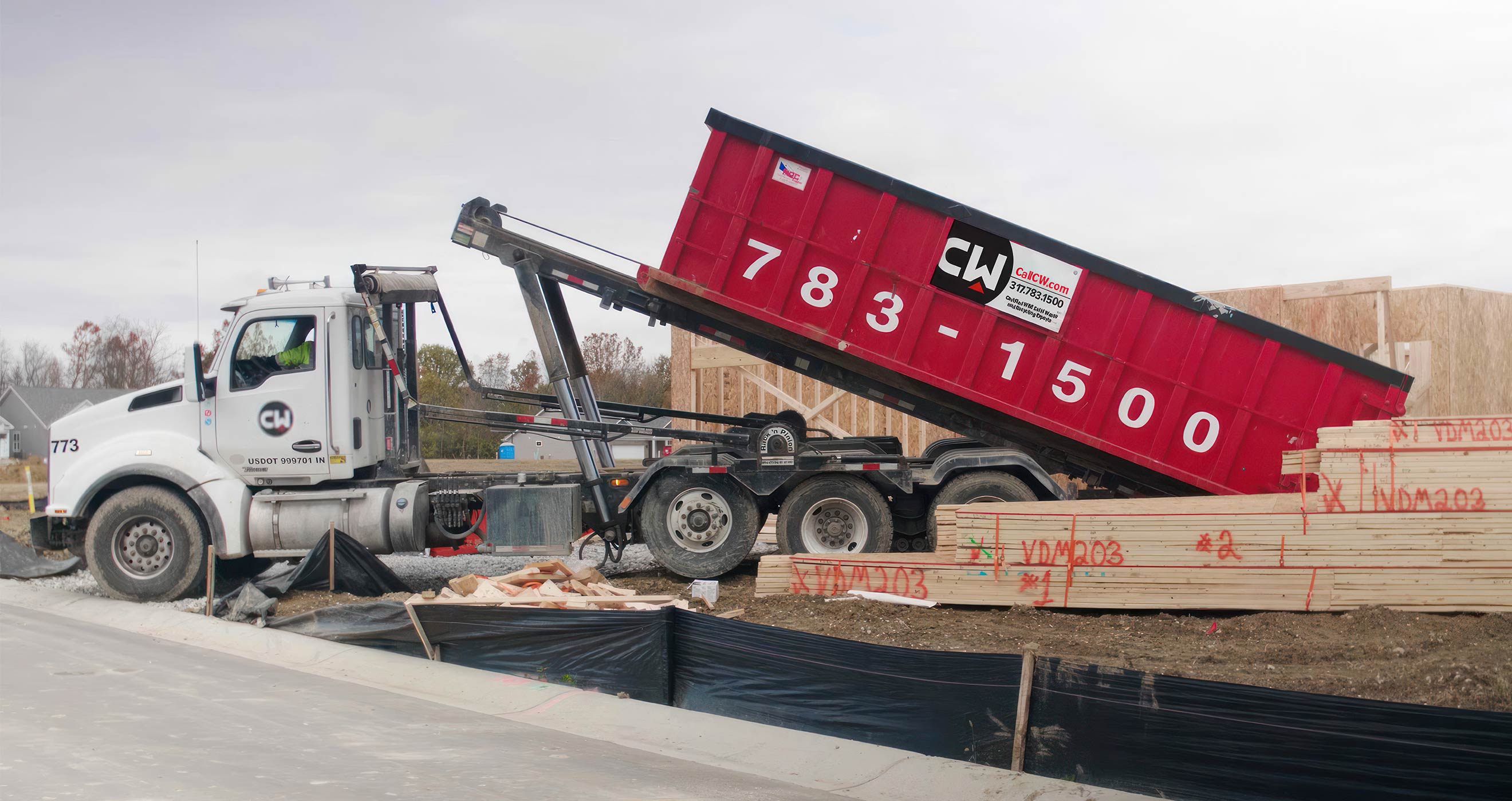 CW roll-off dumpster in a new subdivision